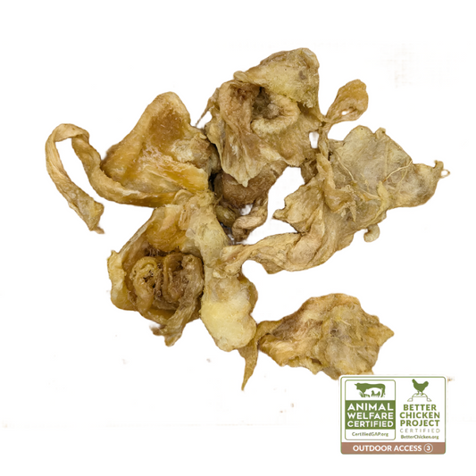 Freeze-Dried Chicken Collagen Chomps 3oz by Wild Nosh Pets on a wooden cutting board with a certification label indicating "Animal Welfare Certified," "Better Chicken Project," "Certified GAP Step 4," and "Outdoor Access," perfect for accompanying dishes featuring heritage breed chickens.