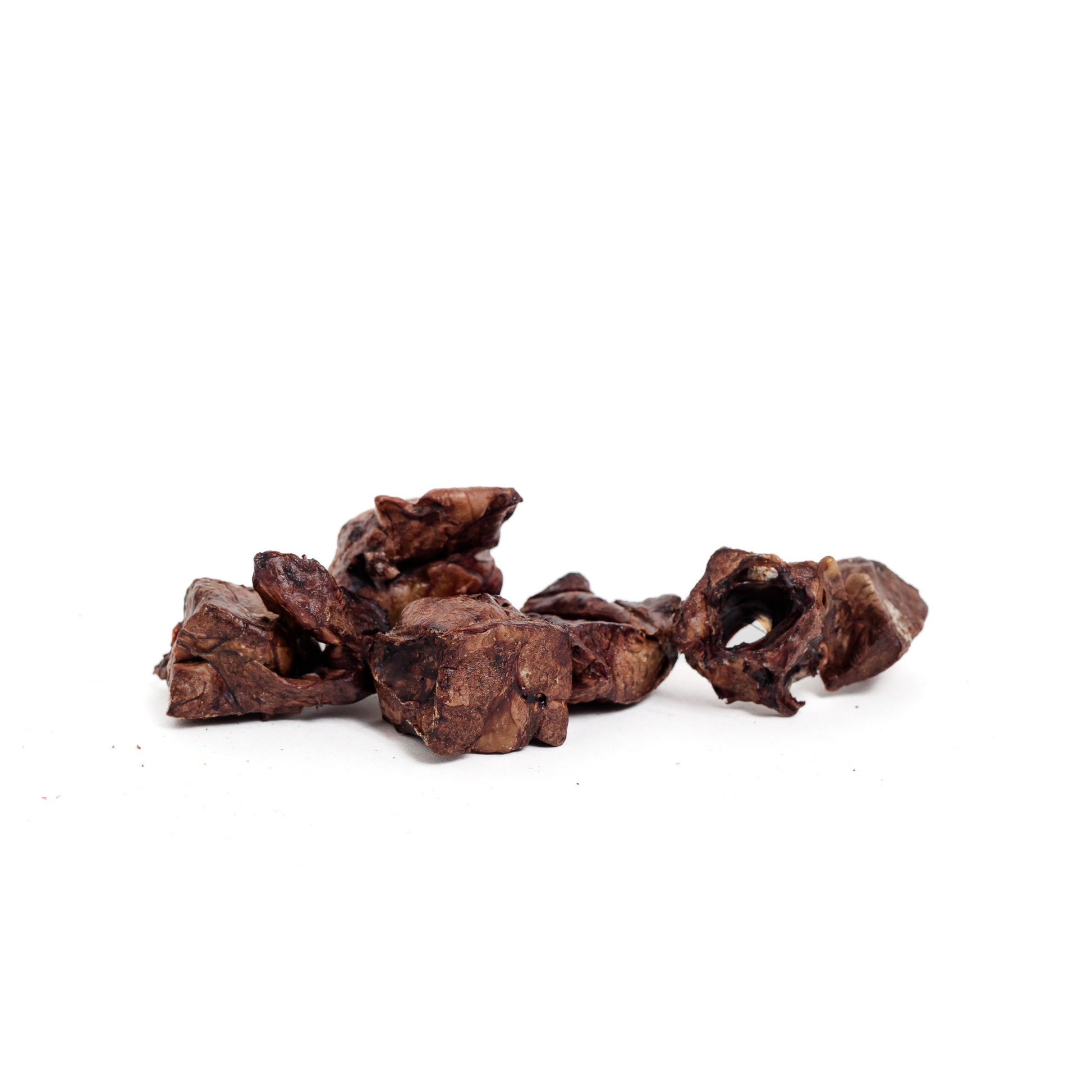 Several pieces of Wild Nosh Pets Dehydrated Bison Lung 3 oz., a crunchy snack made from Colorado bison, are arranged on a white background.