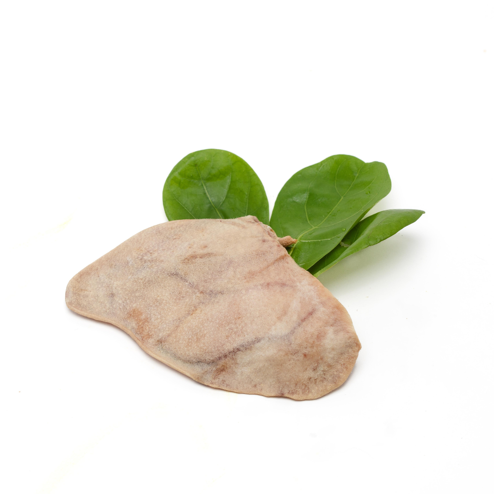 A piece of raw liver with fresh green spinach leaves and Wild Nosh Pets Heritage Breed Freeze-Dried Pig Ears on a white background.