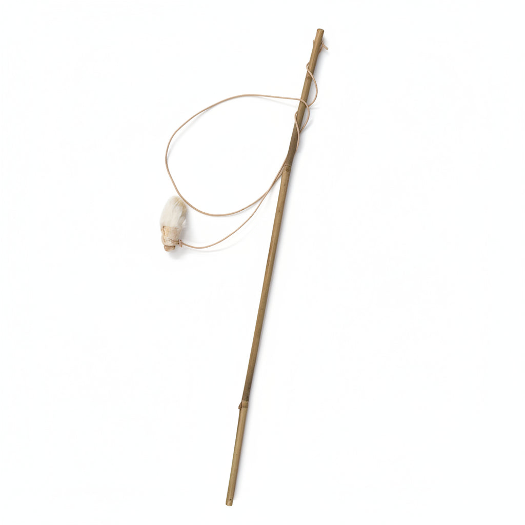 The Wild Nosh Pets Freeze-dried Rabbit Foot Cat Wand Toy features a sustainably sourced bamboo pole with a thin fishing line and a natural rabbit foot lure, photographed on a white background—perfect as an eco-conscious cat toy.