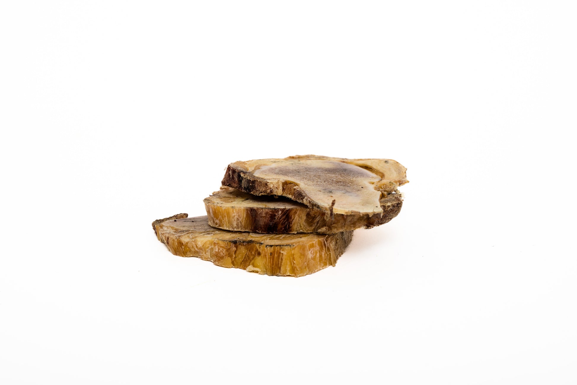 Wild Nosh Pets' Freeze-Dried Bison Knuckle Slice features three visibly ringed knuckle slices stacked on a white background, providing a softer bone treat option for your pet.