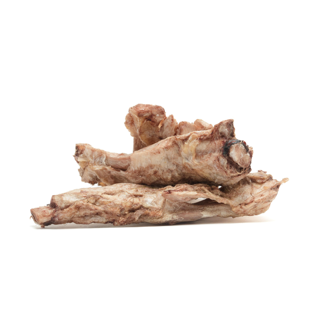 A Freeze-Dried Bison Half Flexor Tendon from Wild Nosh Pets stacked on top of each other against a plain white background, perfect for teething puppies seeking a tasty treat rich in collagen and hyaluronic acid.