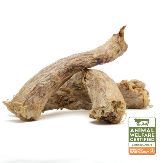 A pile of Wild Nosh Pets Organic Freeze-Dried Turkey Necks is displayed against a white background. An "Animal Welfare Certified" label with GAP Step 2 certification is visible in the lower right corner.