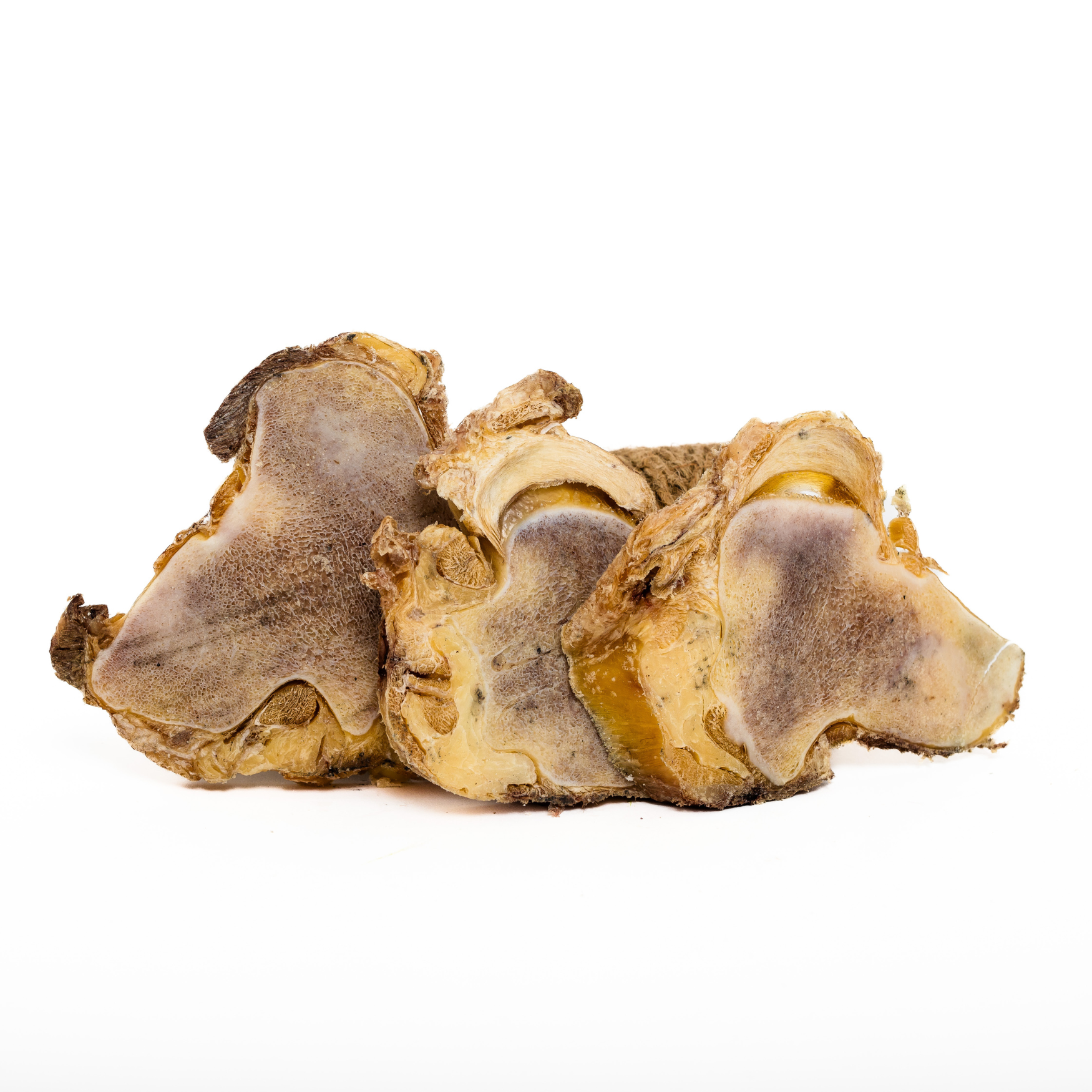 Three large Wild Nosh Pets Freeze-Dried Bison Knuckle Slices, with rough texture and brown color, are arranged side by side on a white background—ideal dog chews.