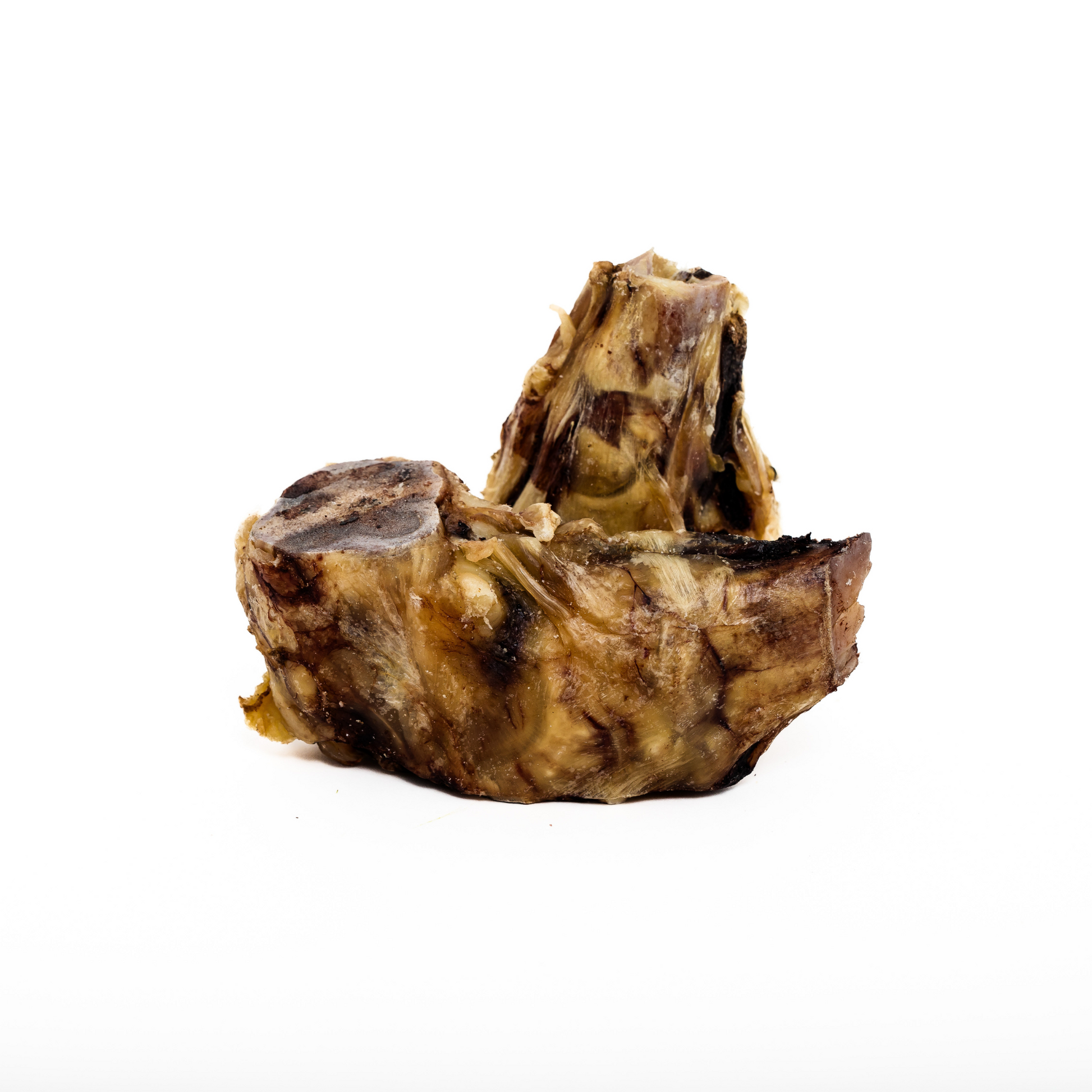 Two pieces of Wild Nosh Pets Baked Bison Elbow showing tender meat and tendon around the bone are displayed on a white background.