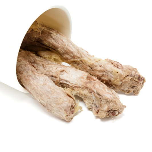 Freeze-Dried Duck Neck from Wild Nosh Pets, beneficial for joint health, spill out from a white container on a white background.