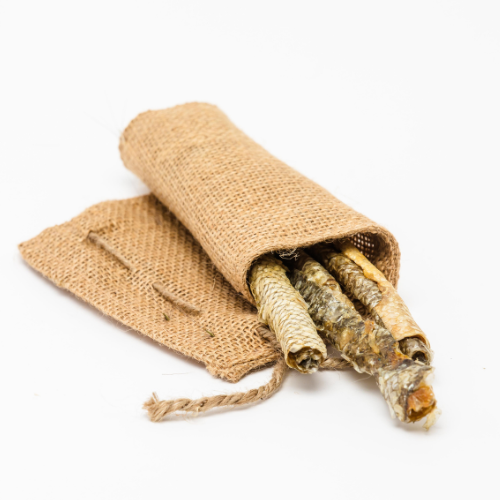 A Wild Nosh Pets Carp Skin Roll, rich in omega fatty acids and perfect for dogs and cats, partially exposed on a white background.