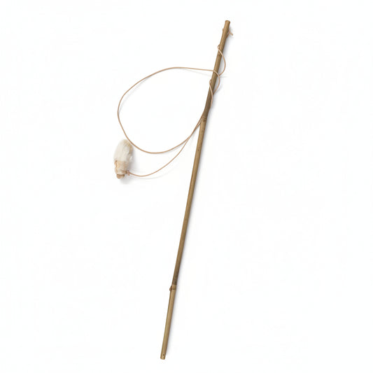 The Wild Nosh Pets Freeze-dried Rabbit Foot Cat Wand Toy features a sustainably sourced bamboo pole with a thin fishing line and a natural rabbit foot lure, photographed on a white background—perfect as an eco-conscious cat toy.